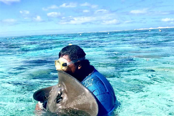 a man swimming in a body of water